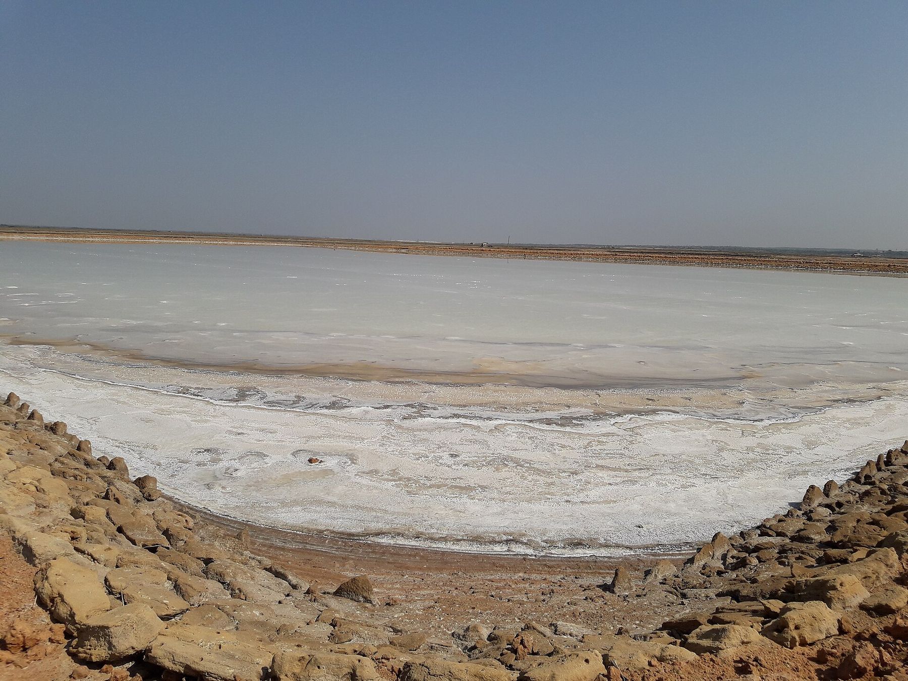 Salt forming at the edge of a pan, Jafrabad