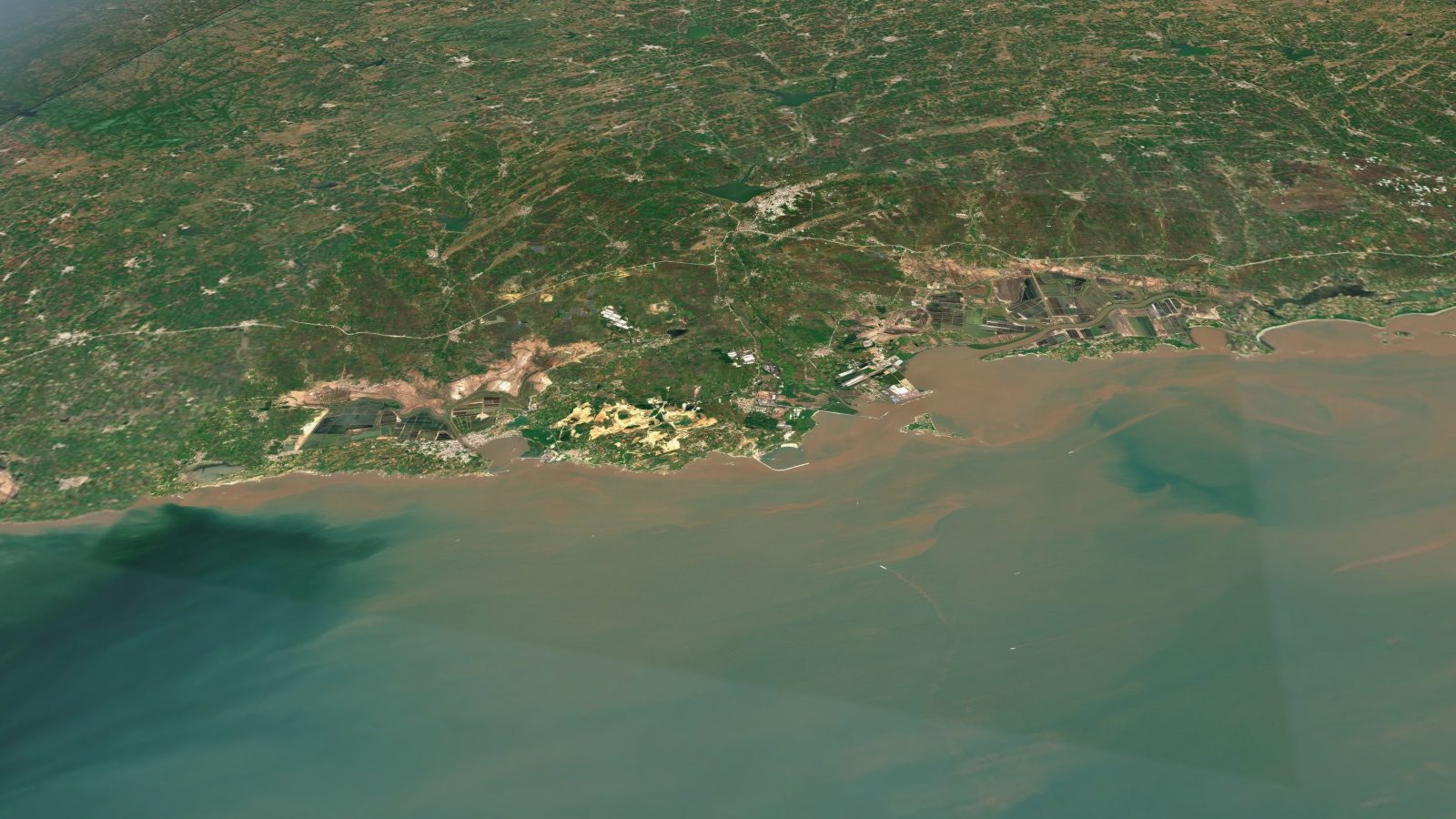 The coast between Jafrabad and Pipavav from the air, in a real satellite image